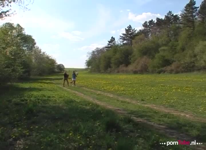 Two girlfriends playing together outside. They take playing together very literally!